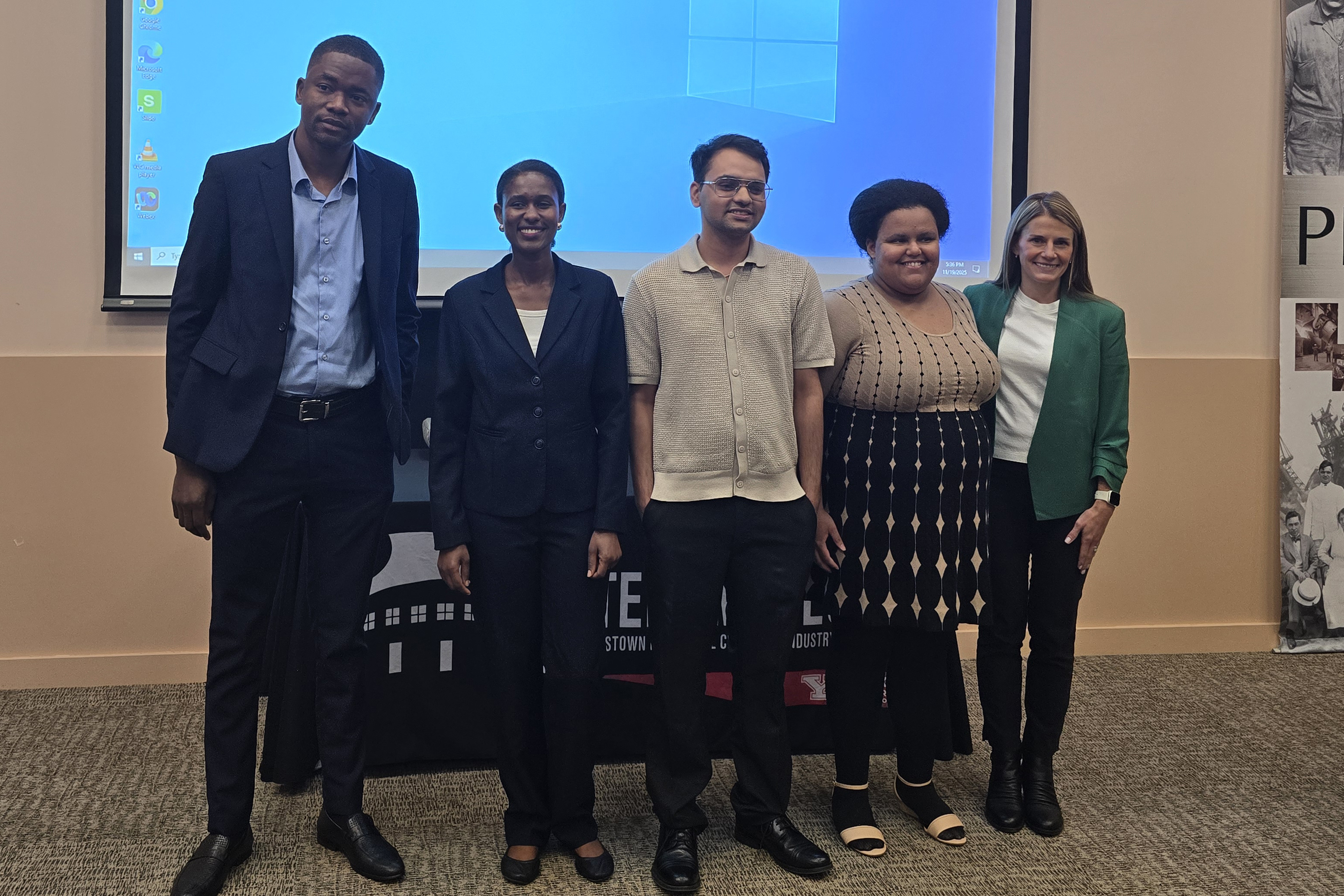 Three Minute Thesis winners Solomon Atta, Shannon Dudash, Lydiah Mairura, Ashley Mangie, and Sagar Pandey pose at the event