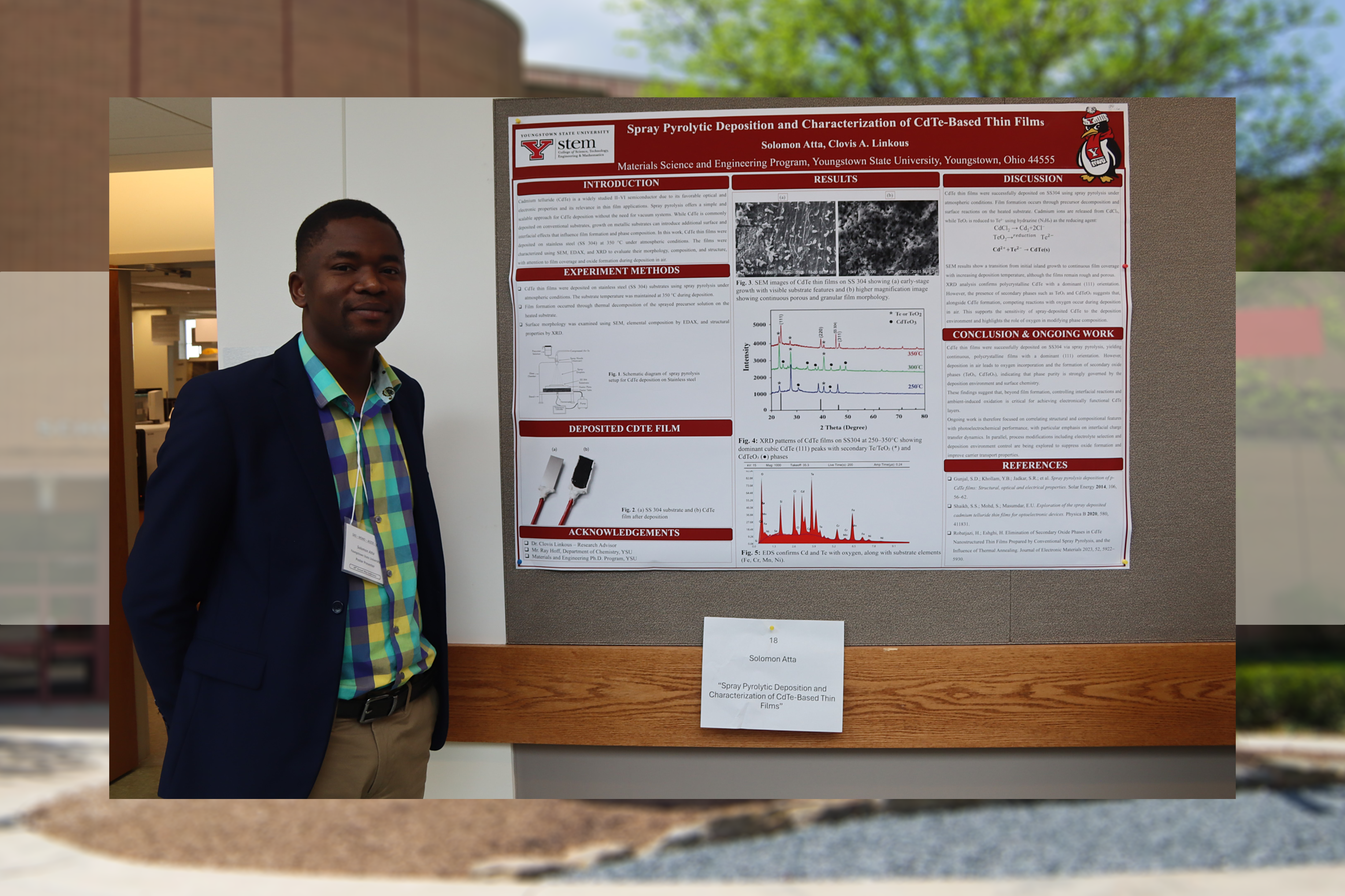 Solomon Atta poses with his research poster at the Society for the Applied Spectroscopy conference