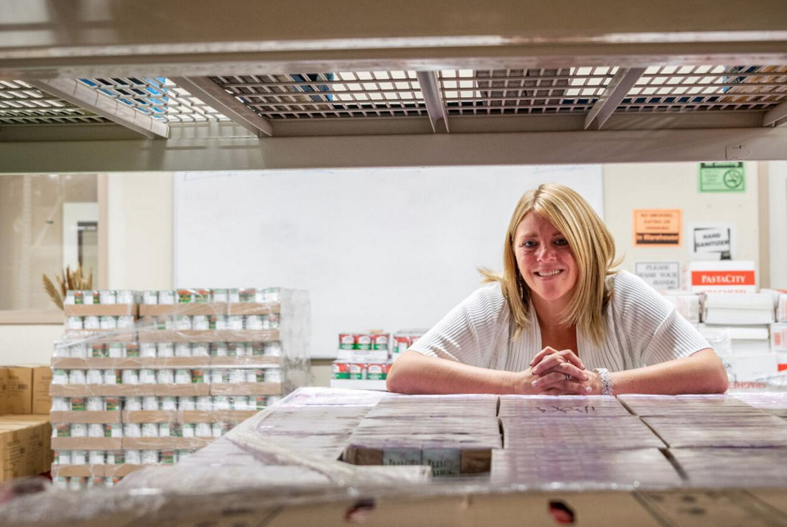 Rebecca Page in a room of packaged foods