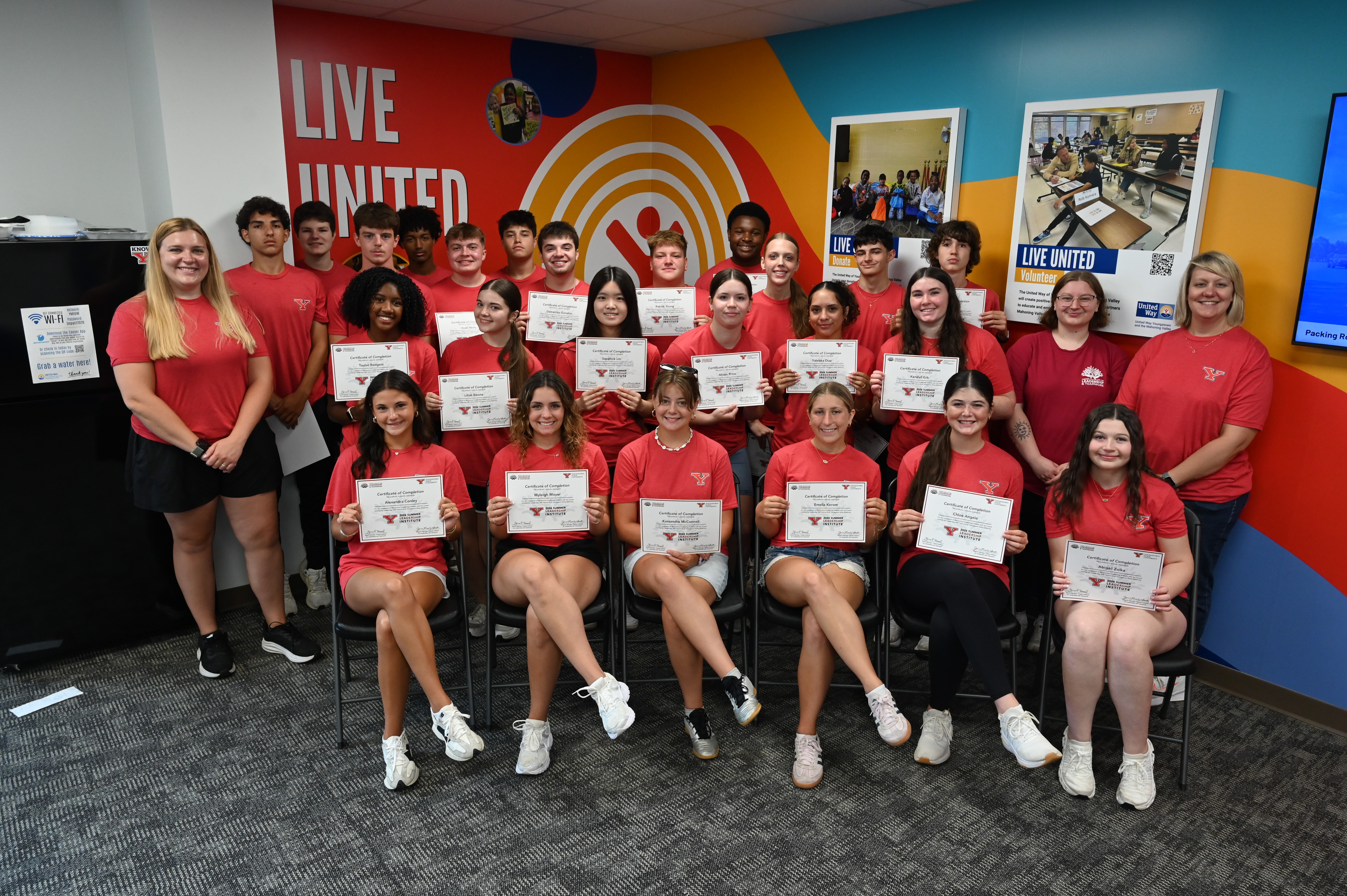 The 2026 Summer Leadership Institute cohort at the United Way displaying their completion certificates