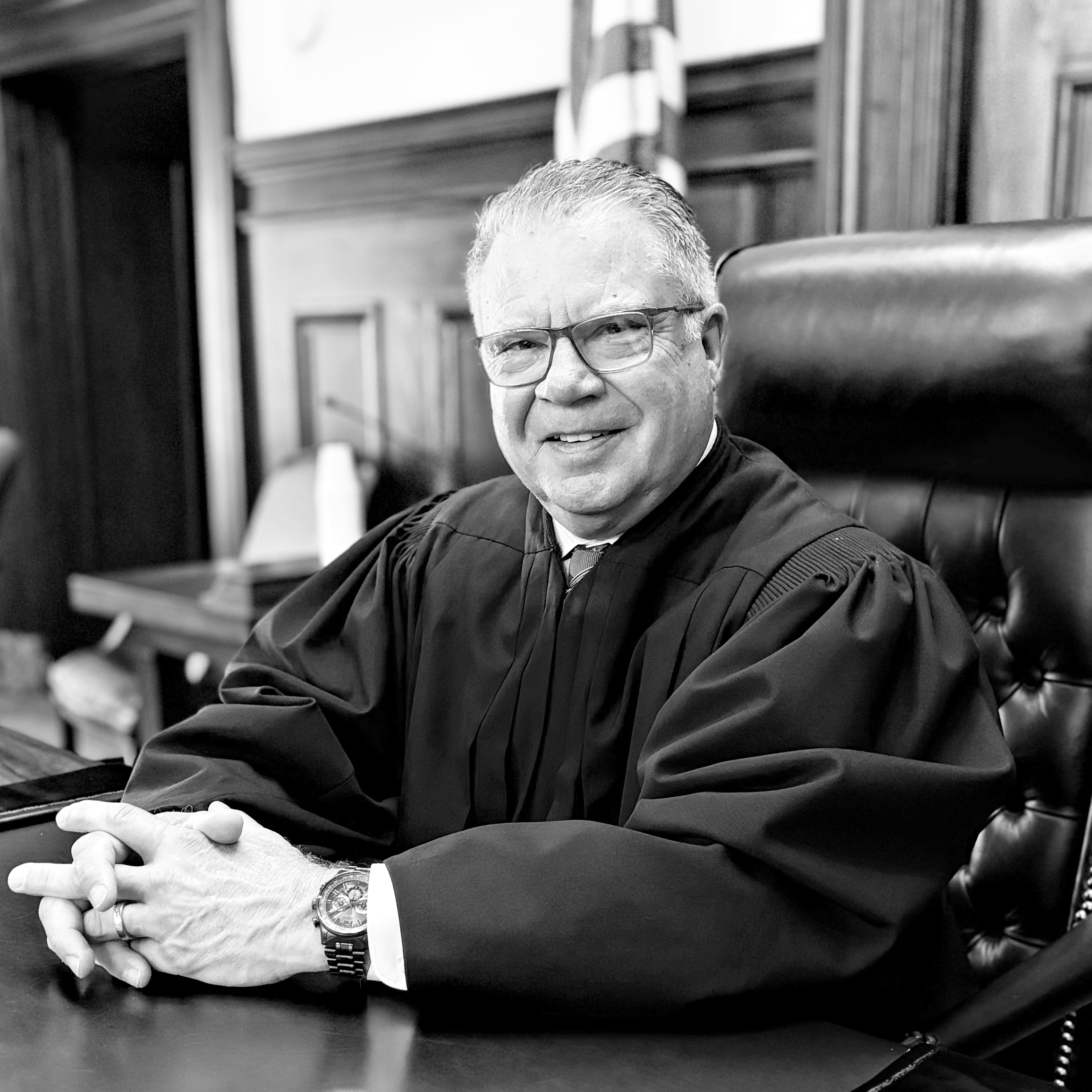 Judge Jack Durkin sitting on the bench in a courtroom