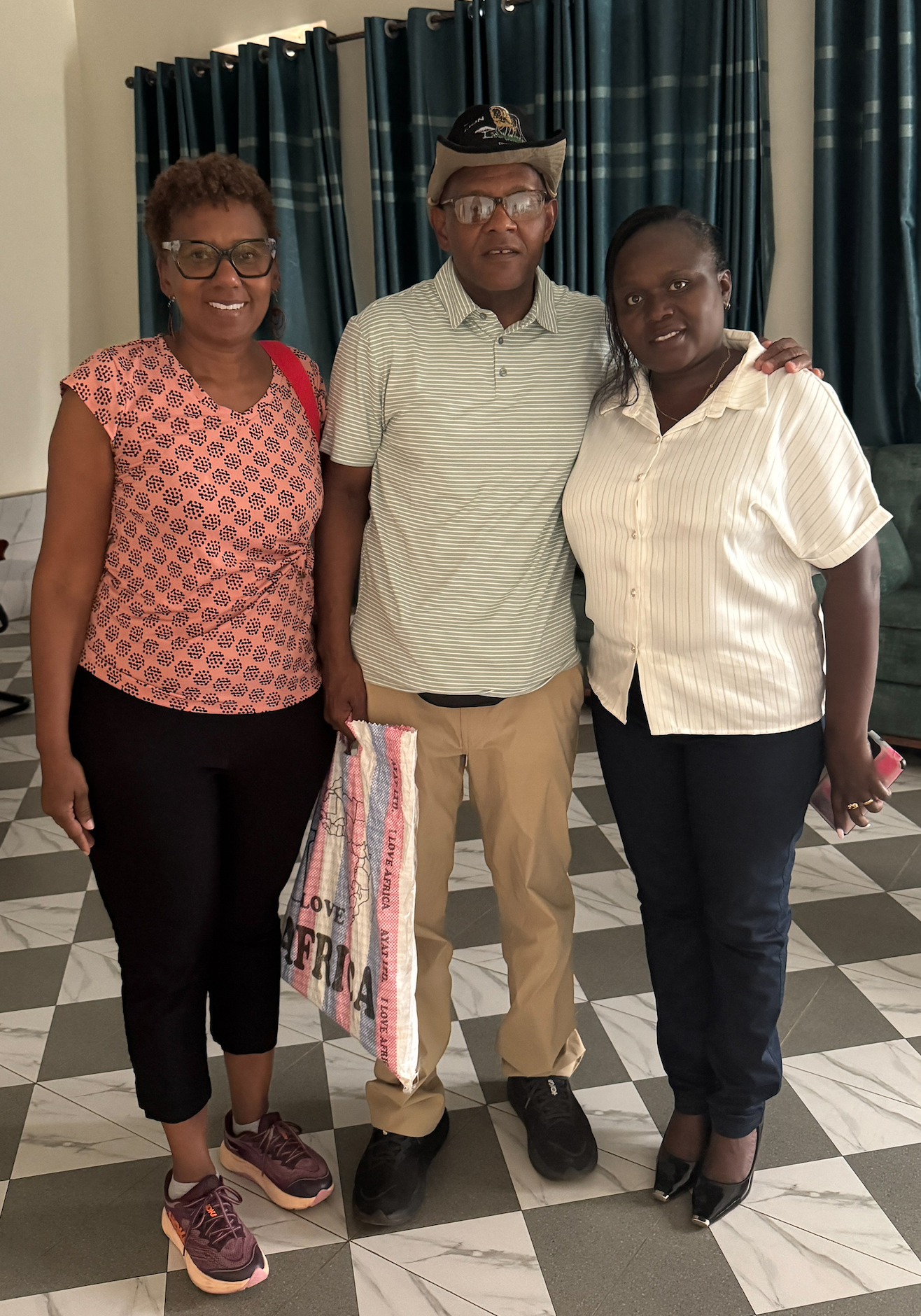 Sherri Harper Woods, Troy Woods, Dative Nakabonye – director of Family Circle of Love Lab Organization