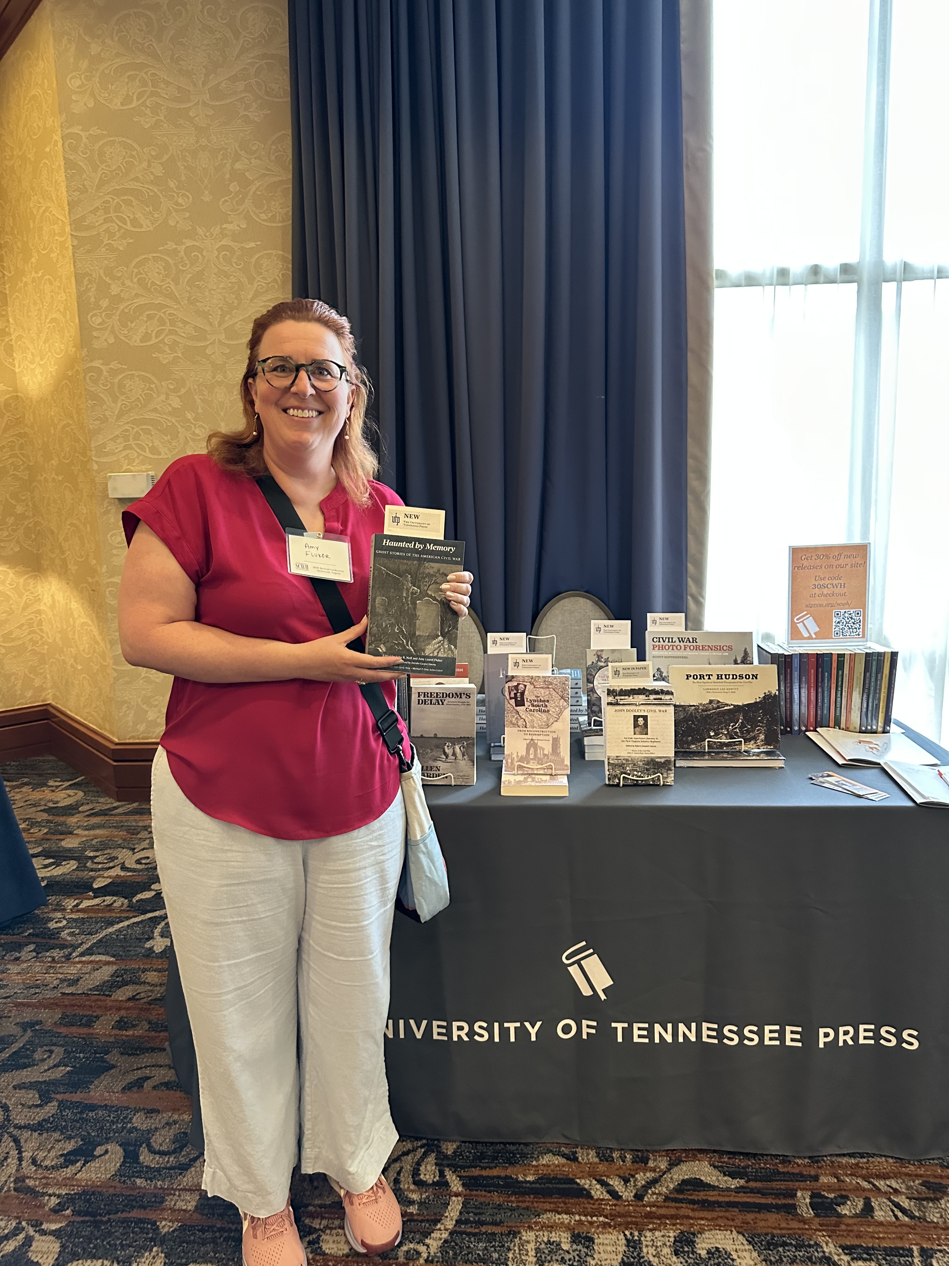 Dr. Amy Fluker poses with her new book at the Society for Civil War Historians conference