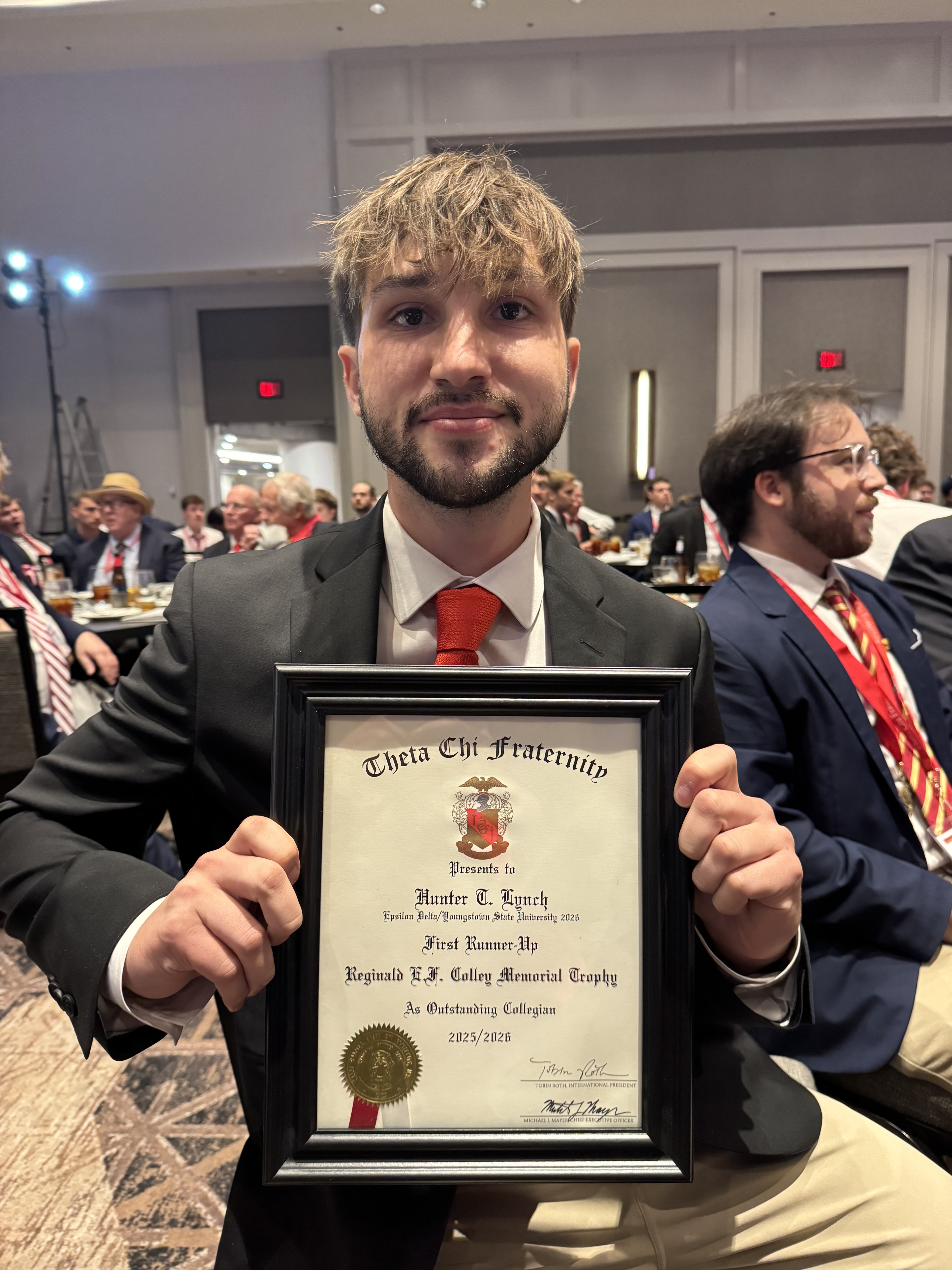 Hunter Lynch poses with his certificate as first runner-up for the Theta Chi Fraternity 2025-26 Reginald E.F. Colley Memorial Trophy