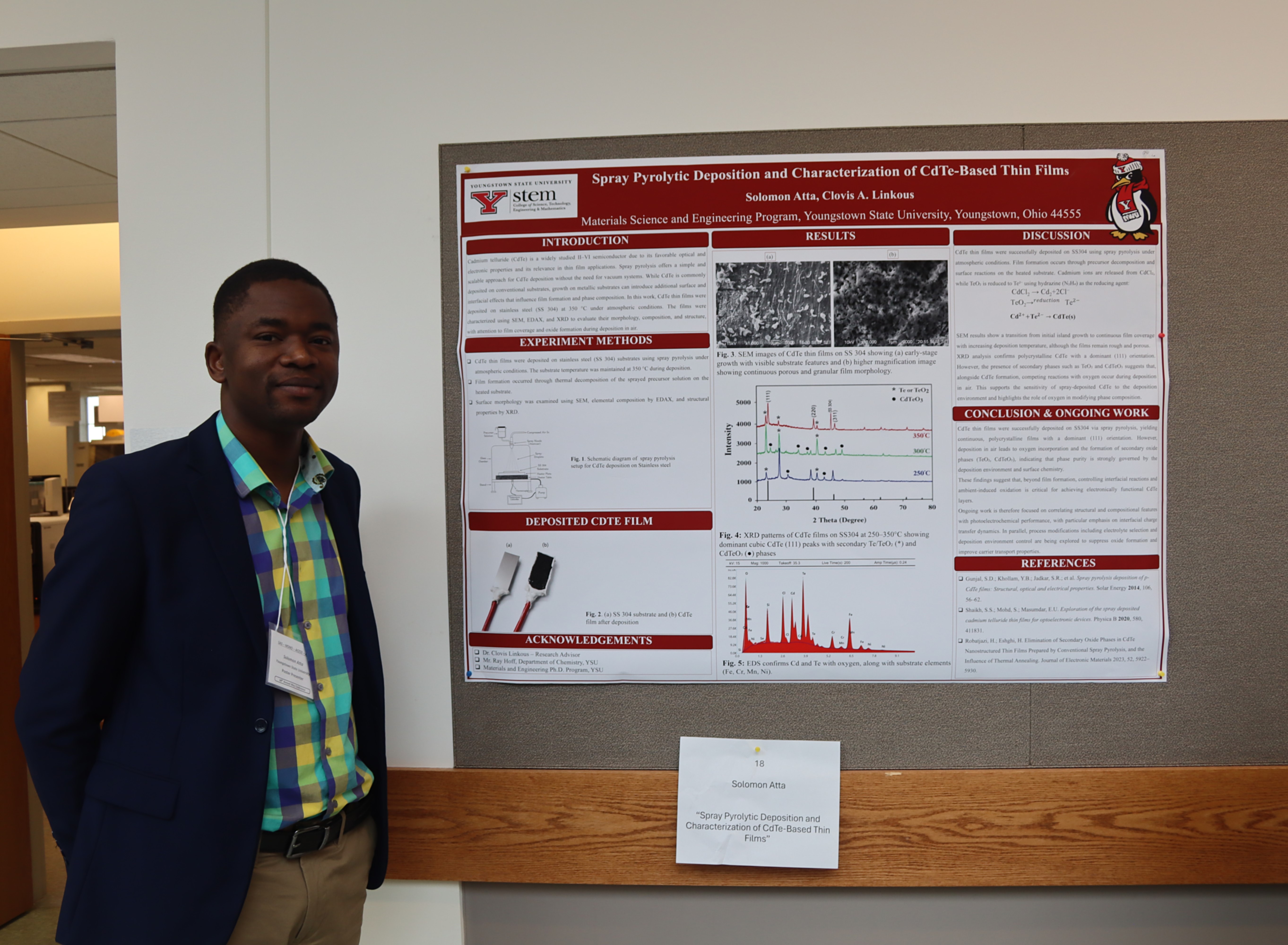 Solomon Atta poses with his research poster at the Society for the Applied Spectroscopy conference