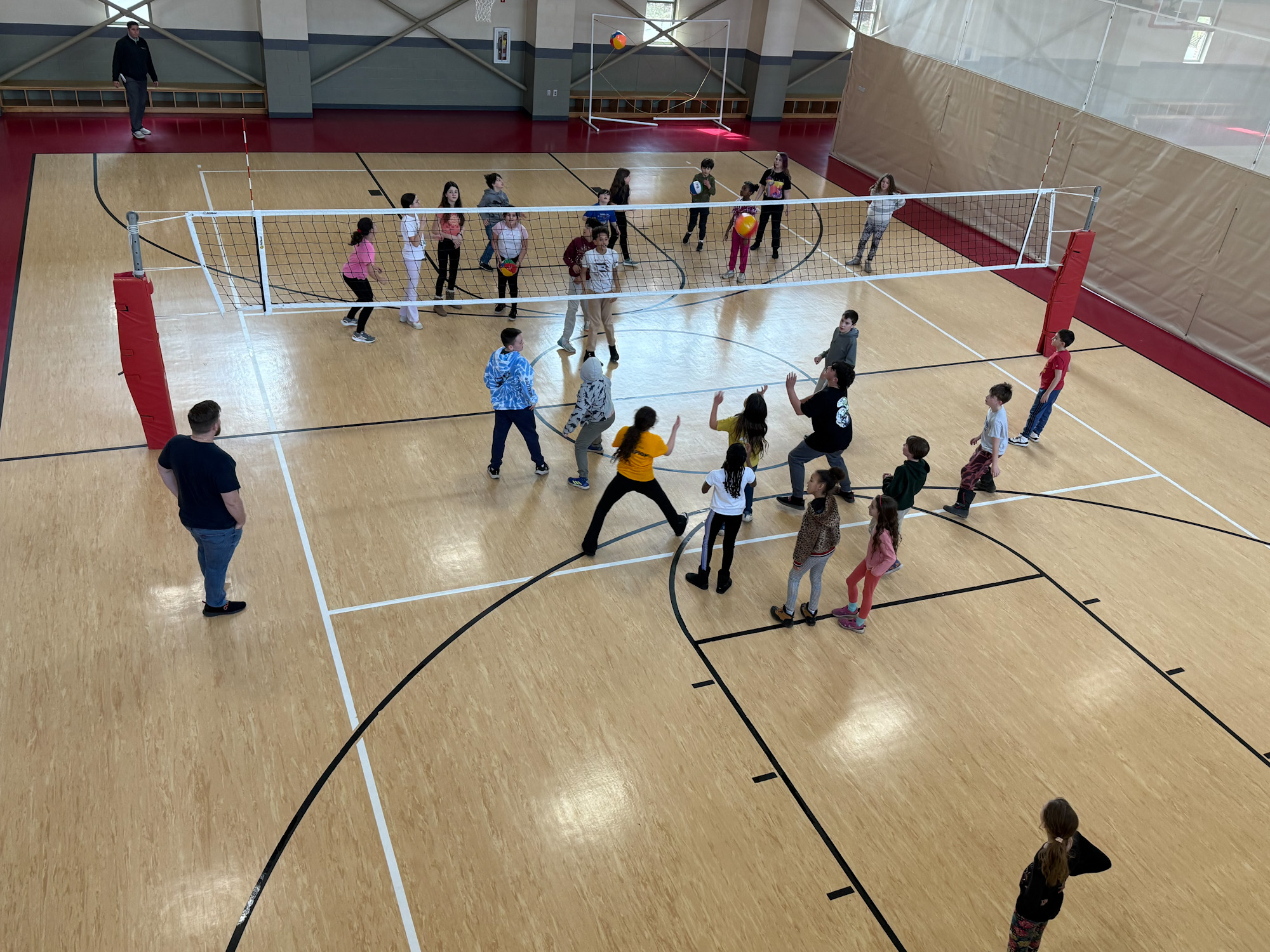 large group playing volleyball