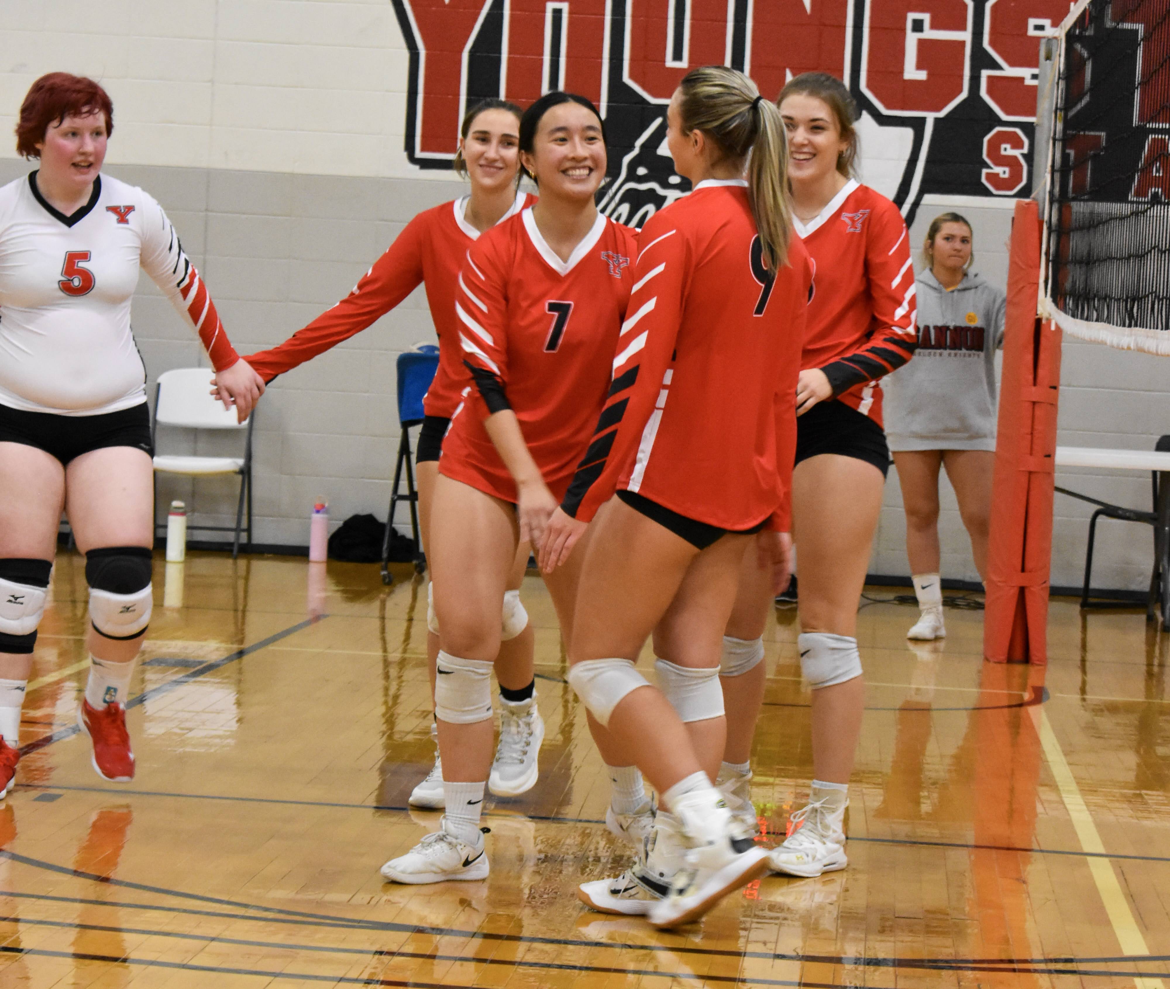 women's volleyball team celebrating a win