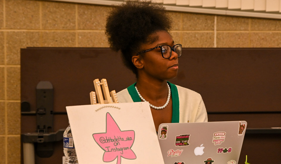 A Alpha Phi Alpha member with laptop.jpg