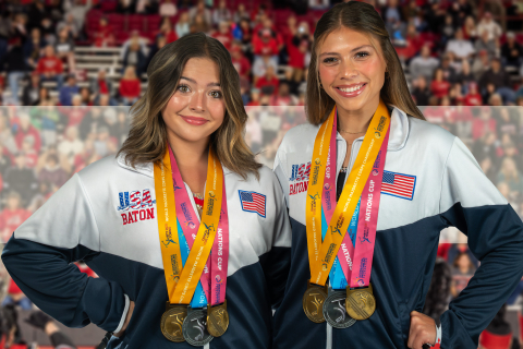Madeline Huff and Kaylynn Egan pose with their two gold medals and one silver medal from the International Baton Twirling Federation World Championships