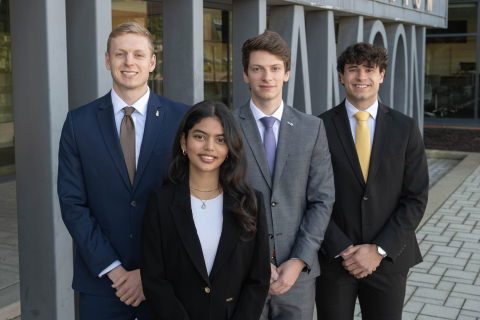 James Slessor, Tanishka Agnihotri, Jan Harter, and Moritz Bayer posing outside of WCBA