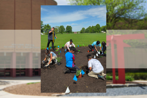 Students from South Side Academy work on the pollinator garden