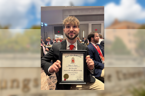 Hunter Lynch poses with his certificate as first runner-up for the Theta Chi Fraternity 2025-26 Reginald E.F. Colley Memorial Trophy
