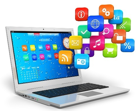 Computer laptop showing various software program icons.