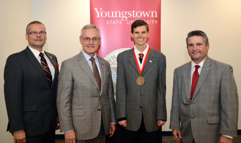 Professor Tim Wakefield receives his Medical Mutual of Ohio Endowed Professor of Actuarial Science medallion. 