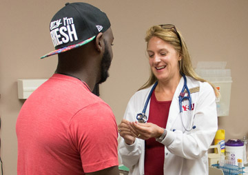 Nurse getting ready to give vaccination to patient
