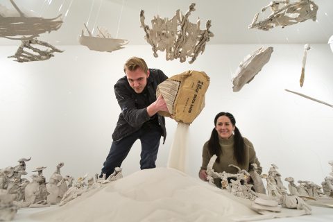 Artist Kimberly Chapman & YSU student Evan Von Thayer install an exhibition at the McDonough Museum