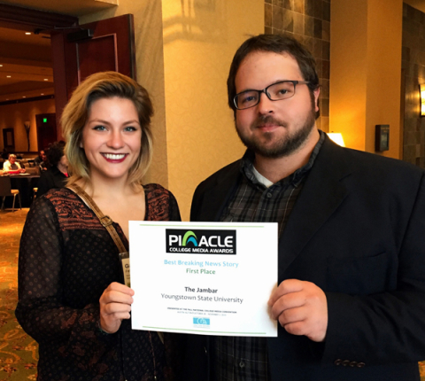 Jambar editors Gabby Fellows, left, and Graig Graziosi, accept the Pinnacle Award at the Naitonal College Media Convention in Austin, Texas.