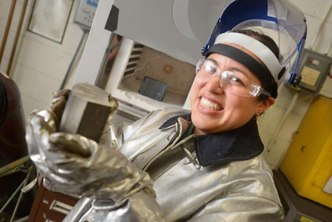 This photo that ran in the Northwest Florida Daily News last July shows Rachel Abrahams holding a piece of the new alloy that she developed at Eglin