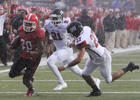 Junior tailback Jody Webb runs through the raindrops at Saturday's contest against St. Francis (Pa.)