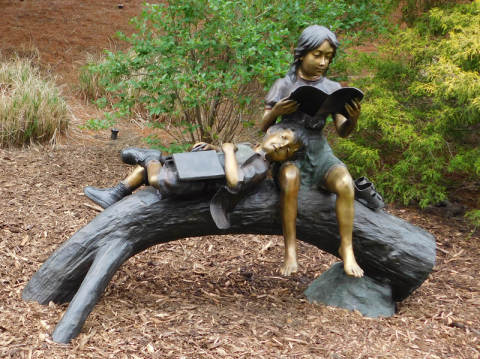 “Break Time” (Two Children on a Log), located in McKay Court near the Beeghly College of Education.