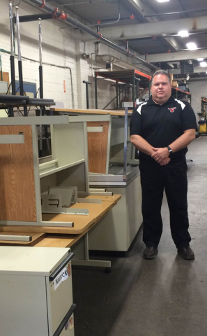 Martyn Moss oversees campus surplus inside the E.J. Salata Complex on Rayen Avenue.