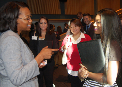 At the WCBA Professional Summit, Trinette Simon, senior manager in Accounting/Auditing with Cohen & Company, speaks about career opportunities with Fierria Hueston, business administration major from West Middlesex, Pa. 