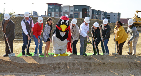 university officials and others grabbed golden shovels and donned Penguin hard hats to break ground 