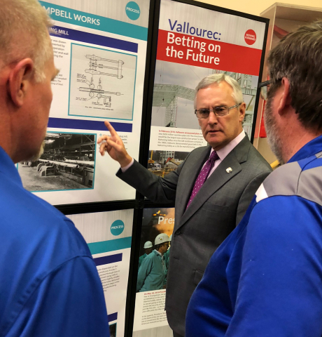 SU President Jim Tressel talks with employees of Vallourec at the new exhibit at the Youngstown Hist