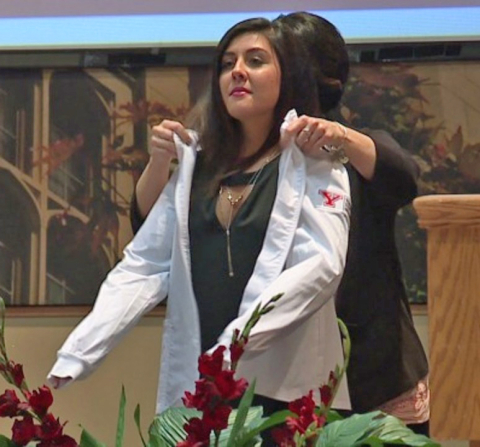 YSU Sophomores receiving their white coats during a ceremony 