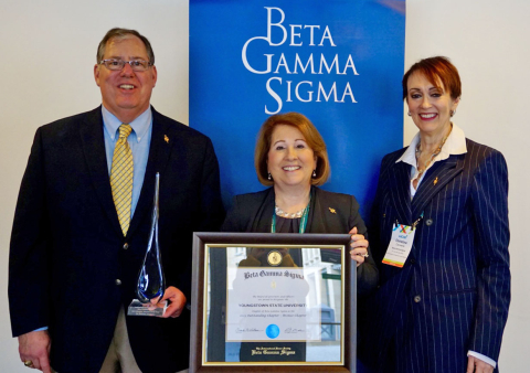 William Vendemia, left, professor of Management, received the international Beta Gamma Sigma Chapter