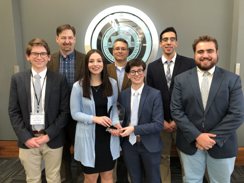 YSU's winning Ethics Bowl team, from the left, Jacob Tomory, Alan Tomhave (coach), Samantha Fritz, M