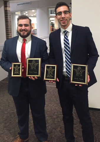 Michael Factor, left, and Moataz Abdelrasoul after winning the Cleveland Marshall Regional Moot Cour