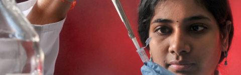 A female conducting lab research