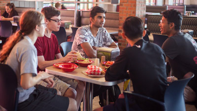 students eating at christman dinning commons